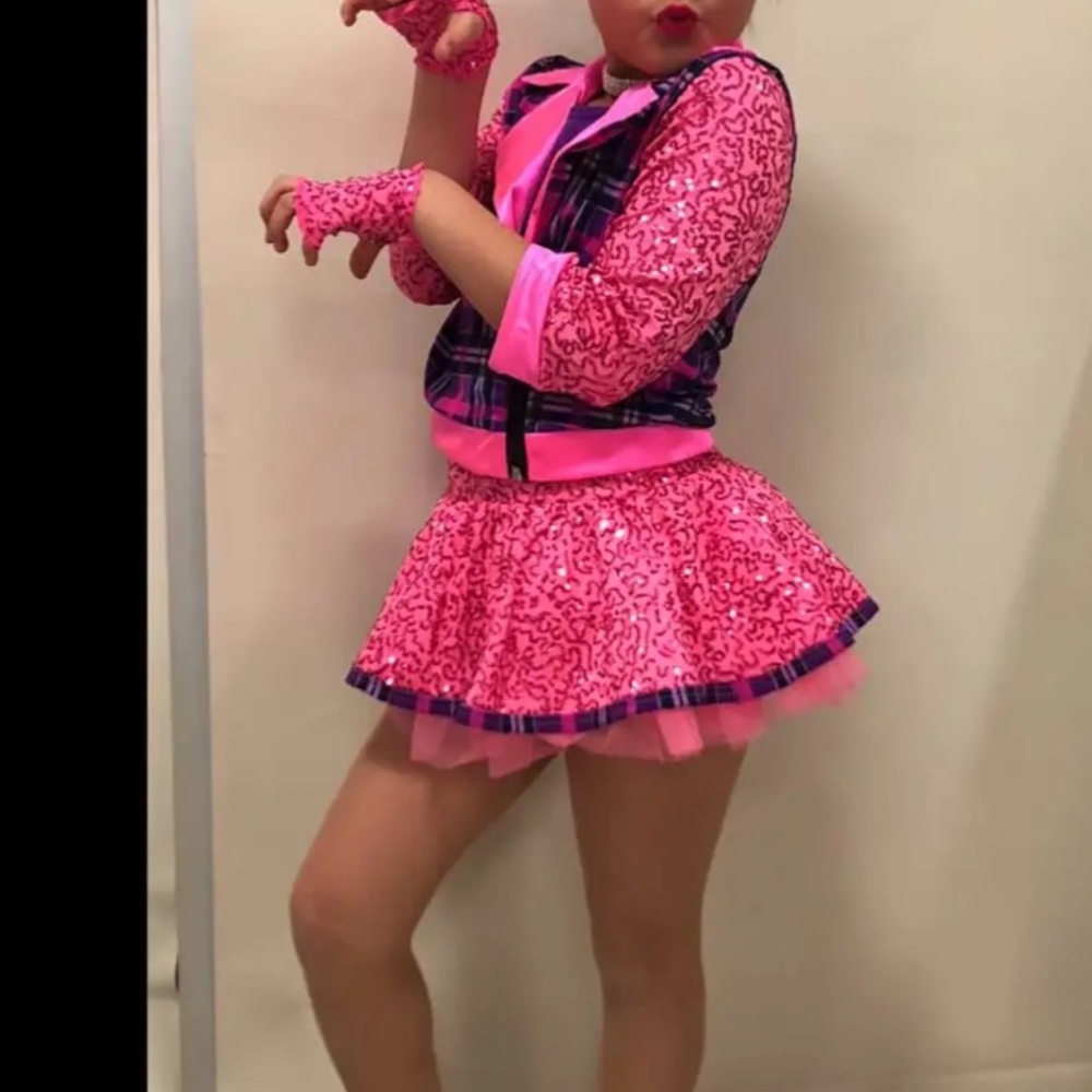 Vibrant Pink and Purple Dance Costume with Sparkly Embellishments